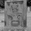 Detail showing reverse face of gravestone of Peter Jeffrey, d.1857. 
Horseshoe, royal crown, hammer and anvil emblems.