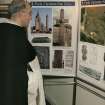 World of Worship exhibition.
Monk viewing the exhibition in the conference room.