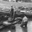 Excavation photograph: View of timbers of bridge found in moat, partial reconstruction.
