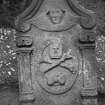 Spott churchyard.
Agnes Dishington d.1724. Reverse face of gravestone; winged cherub, skull, crossbones and hourglass within cartouche inscribed 'MEMENTO MORI'.