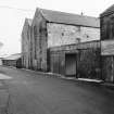 Glenmorangie Distillery
View from WSW showing NW front of warehouses with part of excise office in foreground