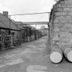 Oldmeldrum, Distillery Road, Glengarioch Distillery
View from SE showing ENE front of Duty Free Warehouse Number 3, 4, and 6, part of ENE front of filling store with part of stillhouse in foreground