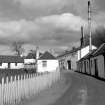 Milton of Edradour, Edradour Distillery
View from SW showing SSE front of cottage, part of WNW front of production block, SSW front of excise office with kiln in background and part of warehouses in foreground