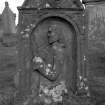 Detail of gravestone commemorating Andrew Pringle, d.1750. Rear face, showing detailed portrait of Andrew Pringle.