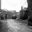 Huntingtowerfield, Bleach and Dye Works
View looking SW along former railway line with bleach croft in background and crane and part of liquor house on right