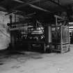 Huntingtowerfield, Bleach and Dye Works, Interior
View looking SW showing belt stretcher 108'' goods which is made by Archibald Edmeston and son limited, Partricroft, Manchester (up to 108'' from 24'')