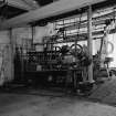 Huntingtowerfield, Bleach and Dye Works, Interior
View looking SW showing belt stretcher 108'' goods which is made by Archibald Edmeston and son limited, Partricroft, Manchester (up to 108'' from 24'')