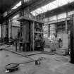 Paisley, MacDowall Street, Caledonia Engineering Works, Interior
View of boiler shop looking SE showing Hugh Smiths vertical shell bender (1 roll, 65cm diameter (26'') x 310cm long (10' 0'') with floor pockets for rollers on the right