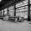 Paisley, MacDowall Street, Caledonia Engineering Works, Interior
View of boiler shop looking NE showing Hugh Smiths plate rolling machine (3 rolls, 310cm long (10' 0'') with shop air heater behind head stock of rolling machine