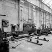 Paisley, MacDowall Street, Caledonia Engineering Works, Interior
View of boiler shop looking SE showing plate edge profile burner/cutter machine which is mouted on the bed of an old lathe which is made by Shanks and Company