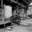 Paisley, MacDowall Street, Caledonia Engineering Works, Interior
View of boiler shop looking NW showing hydraulic riveting machine which has been converted to a plate bender (gap between legs of frame 40cm x 110cm from ram to back of frame) with shop air heater to left