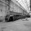 Paisley, MacDowall Street, Caledonia Engineering Works, Interior
View of boiler shop looking S showing horizontal edge planing machine which is made by James Bennie and Son, Glasgow