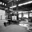 Paisley, MacDowall Street, Caledonia Engineering Works, Interior
View of boiler shop looking NE showing punching and shearing machine complete with lifting jib (made by G Edward and Company Engineers, Johnstone) with door to gama-ray compound on left