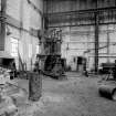 Paisley, MacDowall Street, Caledonia Engineering Works, Interior
View looking SW at S end of boiler shop showing hydraulic flanging machine (made by Fielding and Platt, Gloucester, England) with edge of curved stove to left