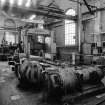 Paisley, MacDowall Street, Caledonia Engineering Works, Interior
View of W end of machine shop (W of heavy machine shop) looking W showing planer and motors