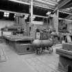 Coatbridge Engine Works, Engineering Shop; Interior
View in W (No. 3) bay of Butler No.200 open sided planer, to the right is Union No. 418 horizontal boring machine; in the foreground is an electric arc welding machine