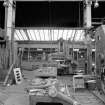 Coatbridge Engine Works, Engineering Shop; Interior
View in E (No. 2) bay showing Stirk No. 213 open sided planer (max. job piece 1.8m wide, 1.2m high, 3m long). IN the forground and to the right are parts of a brick press under repair