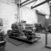 Coatbridge Engine Works, Engineering Shop; Interior
View by S wall of engineering shop; centre of shot is short bed centre lathe No. 124 Lang, in right background is short bed centre lathe No. 130 Lang