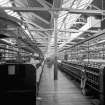 Paisley, Ferguslie Thread Mills, Mill No.1, 5th Flat; Interior
View between spinning machines, looking from W end towards centre of flat