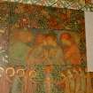 Interior. North chapel, detail of mural on north wall depicting embracing figures.