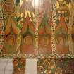 Interior. North chapel, detail of mural frieze depicting heads of angels.