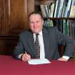 RCAHMS AT WORK.
Official photograph of Roger Mercer, Secretary of RCAHMS (1990-2004). Taken in his office.