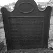 Cast-iron gravemarker commemorating Margaret Adamson, d.1815. Marker displays the emblems of a gunmaker (crossed guns beneath a crown).