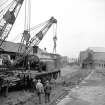 Glasgow, Govan Goods Yard
View from S showing cranes lifting locomotive number 123 with loading shed in background