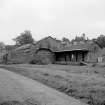 Newtyle, Old Station
View from N showing NW front of train shed and NE and NW fronts of offices with post crane circular base on left