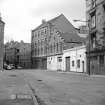 Glasgow, 49-55 Weir Street, Wire Weaving Factory
View from S showing WSW front of wire weaving factory with offices of Dock Engine and Boiler Works in background and cooperage in foreground
