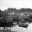 St Andrews Harbour, Rolling Suspension Footbridge
View from ENE showing NNE front of bridge with store in background