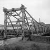 Paisley, Carlile Place, Footbridge
View from W showing WNW and SSW fronts of footbridge with gantry in background