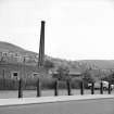 Galashiels, Low Buckholmside, Comelybank Mill
View from WSW showing chimney and part of mill with houses in background