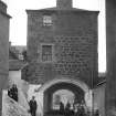 The Citadel Arch, Dock Street, Edinburgh with people. Since demolished.