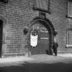 Edinburgh, 13 John's Place.
View of doorway and fenders at warehouse entrance.