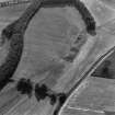 Spittalfield and Wester Drumatherty, oblique aerial view, taken from the ENE, centred on the cropmarks of a Roman road and quarry pits, a linear cropmark, a palisaded enclosure, a possible pit-alignment, a round house and souterrains.