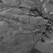 Glen Fender, oblique aerial view, taken from the SSE, centred on the remains of a farmstead, buildings and township.