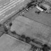 Merryless, oblique aerial view, taken from the WSW, centred on cropmarks of parts of the military camp. The last remaining building is visible in the top right-hand corner of the photograph.