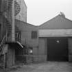 Glasgow, 87-97 Surrey Street, Gorbals Grain Mills
View looking NNE showing SSW front of N outbuilding with part of spiral staircase on left