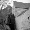 View from SE showing waterwheel and part of mill