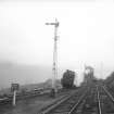 View looking NNE showing locomotive at station with signal box in background