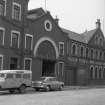 View from SE showing part of E front of Brass Foundry with Glasgow Saw and File Works in background
