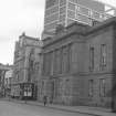 View from SSE showing SW front of Custom House with public house in background