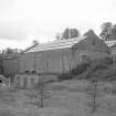 View from N showing NE front and part of NW front of waterwheel house/power station