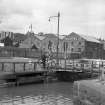 View from SW showing WSW front of bridge with bonded warehouse in background