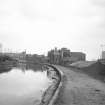 View from NW showing NW front of maltings with canal on left and part of Hopehill Works on right