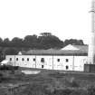 View from S showing SW front of S block of works with viaduct in background