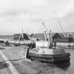 View from SSE showing workboat at N end of Muirtown Basin with crab winch and workshops in background