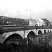 View from S showing ESE front of Glasgow Bridge with railway bridge on left