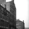 View from S showing ESE front of warehouse with part of sawmill in foreground